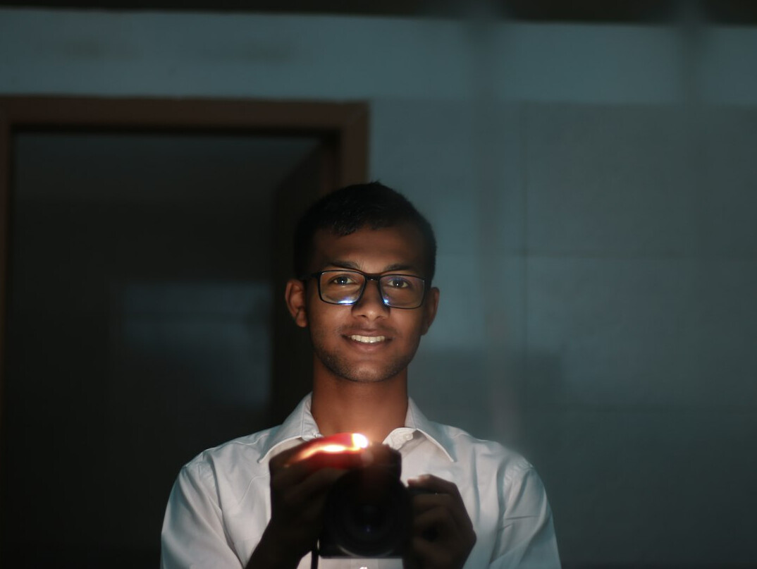 Portrait of a lighting engineer holding a light meter