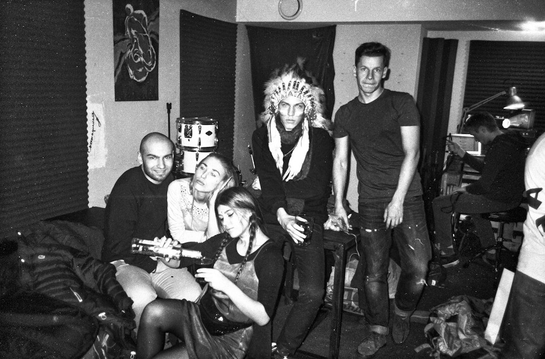 Diverse television production crew standing together on a studio set